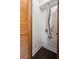 Small laundry room with dark floors and a louvered door at 2479 Peachtree Ne Rd # 1703, Atlanta, GA 30305