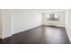 Vacant living room with hardwood floors, window, and white walls for personalization at 2479 Peachtree Ne Rd # 1703, Atlanta, GA 30305