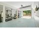 This spacious garage with gym includes weights and exercise equipment; perfect for fitness enthusiasts at 3003 Maple Ln, Alpharetta, GA 30009