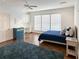 Bright bedroom with built-in desk, large windows, ceiling fan, and wood floors at 366 Blackland Nw Rd, Atlanta, GA 30342