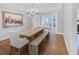 Formal dining area with a chandelier, bench seating, and a contemporary design at 366 Blackland Nw Rd, Atlanta, GA 30342