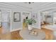 Inviting foyer with hardwood floors, a round table with flowers, and views of other rooms at 366 Blackland Nw Rd, Atlanta, GA 30342