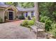 Inviting front entrance features stone pavers, a wooden bench, and landscaping adding to the curb appeal at 366 Blackland Nw Rd, Atlanta, GA 30342