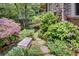Lush landscaping design with a stone path, bushes and brick home exterior visible in this image at 366 Blackland Nw Rd, Atlanta, GA 30342