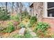 Beautiful backyard with lush landscaping and a stone pathway to a cozy outdoor space at 366 Blackland Nw Rd, Atlanta, GA 30342