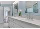 Bathroom featuring double sinks and a white marble countertop at 10275 Worthington Mnr, Suwanee, GA 30024