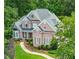 Beautiful brick home with manicured lawn and landscaping at 10275 Worthington Mnr, Suwanee, GA 30024