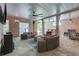 View of outdoor lounge area with seating, speakers, brick wall, and covered ceiling at 10275 Worthington Mnr, Suwanee, GA 30024