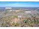 An aerial view displays Oxford, GA property near Kent Rock Rd and Gum Creek at 1315 Woodland Sw Dr, Oxford, GA 30054