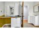 Bright bathroom with vanity and adjacent counter space, perfect for storage and organization at 1315 Woodland Sw Dr, Oxford, GA 30054