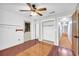 Bedroom with wood flooring, an interior closet, and a door with unique glass details for added character at 1315 Woodland Sw Dr, Oxford, GA 30054