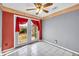 Bright bedroom with natural light streaming through double doors and neutral wall paint at 1315 Woodland Sw Dr, Oxford, GA 30054