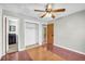 Bedroom featuring a closet, interior doorways, and hardwood flooring, creating a cozy atmosphere at 1315 Woodland Sw Dr, Oxford, GA 30054