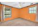 Bedroom featuring two windows and carpeted floors at 1315 Woodland Sw Dr, Oxford, GA 30054