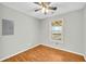 This bedroom features wood floors, a window, and natural lighting at 1315 Woodland Sw Dr, Oxford, GA 30054