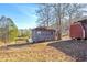 A quaint outbuilding and barn shed, adding character and functionality to the property at 1315 Woodland Sw Dr, Oxford, GA 30054