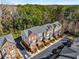 Aerial view of townhouses with manicured lawns, trees, and driveway at 2251 Limehurst Ne Dr, Atlanta, GA 30319