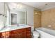 Bathroom featuring vanity with ample counter space and tiled shower over bathtub at 2251 Limehurst Ne Dr, Atlanta, GA 30319