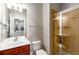 Bathroom featuring a glass shower, single sink, and large mirror at 2251 Limehurst Ne Dr, Atlanta, GA 30319