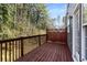 Exterior shot of wood deck with view of trees, offering a peaceful outdoor retreat off the main house at 2251 Limehurst Ne Dr, Atlanta, GA 30319