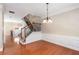 Dining area showcases hardwood floors, decorative trim, and a grand staircase with wrought iron details at 2251 Limehurst Ne Dr, Atlanta, GA 30319