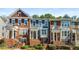 Charming townhome showcasing brick facade, varied architectural details, covered entryways, and well-maintained landscaping at 2251 Limehurst Ne Dr, Atlanta, GA 30319