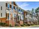 Exterior of townhouse with brick facade and covered front porches at 2251 Limehurst Ne Dr, Atlanta, GA 30319