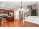 Open-concept kitchen with granite counters and stainless appliances, flowing into dining area and grand staircase at 2251 Limehurst Ne Dr, Atlanta, GA 30319