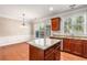 Bright kitchen featuring granite countertops, stainless steel appliances, and hardwood floors, adjacent to dining area at 2251 Limehurst Ne Dr, Atlanta, GA 30319