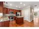 Modern kitchen with stainless steel appliances, granite countertops, kitchen island, and wood cabinetry at 2251 Limehurst Ne Dr, Atlanta, GA 30319