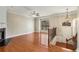 Bright living room featuring hardwood floors, fireplace, staircase, and large window providing natural light at 2251 Limehurst Ne Dr, Atlanta, GA 30319