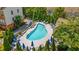 Aerial view of community pool with lounge chairs and blue umbrellas at 2251 Limehurst Ne Dr, Atlanta, GA 30319