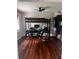 Bedroom featuring a modern loft bed frame with a built-in desk area and dark-stained hardwood floors at 3868 Demooney Rd, Atlanta, GA 30349