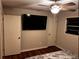 Bedroom featuring ceiling fan and flat-screen TV mounted to wall at 3868 Demooney Rd, Atlanta, GA 30349