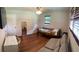 Bright bedroom featuring wood floors, neutral walls, and a ceiling fan at 3868 Demooney Rd, Atlanta, GA 30349