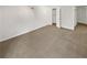 Bedroom featuring neutral colored walls and carpet, and closet space at 4254 Timber Trace Rd, Loganville, GA 30052