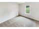 Bedroom featuring neutral colored walls and carpet, along with a view to outside at 4254 Timber Trace Rd, Loganville, GA 30052