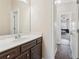 Comfortable bathroom with sink and vanity just off the hallway at 590 Palm Springs Cir, Fairburn, GA 30213