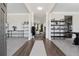 Inviting foyer with hardwood floors, neutral walls, and views into the home's living spaces at 590 Palm Springs Cir, Fairburn, GA 30213