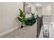 Hallway seating area with modern decor and iron railing overlooking staircase at 590 Palm Springs Cir, Fairburn, GA 30213