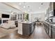 Open concept kitchen featuring stainless steel appliances, granite countertops, and an island with seating at 590 Palm Springs Cir, Fairburn, GA 30213