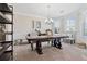 Formal office with wainscoting, carpet, large bay window, and a decorative chandelier at 590 Palm Springs Cir, Fairburn, GA 30213