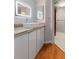 Modern bathroom featuring vessel sink, wood countertop, and decorative mirror at 199 14Th Ne St # 1704, Atlanta, GA 30309