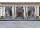 The Mayfair Tower entrance has three entryways with black awnings and a grey tiled walkway at 199 14Th Ne St # 1704, Atlanta, GA 30309