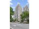 Stunning exterior of Mayfair Towers with manicured landscaping, and a view of the building's architecture at 199 14Th Ne St # 1704, Atlanta, GA 30309