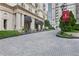 Elegant entrance to the Mayfair, with a landscaped driveway and architectural details at 199 14Th Ne St # 1704, Atlanta, GA 30309