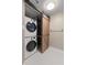 Convenient laundry space with stacked washer/dryer and sliding barn door at 199 14Th Ne St # 1704, Atlanta, GA 30309