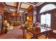 Library with bookshelves, comfortable seating, and coffered ceilings at 199 14Th Ne St # 1704, Atlanta, GA 30309