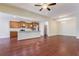 Open living space featuring hardwood floors, a fireplace, a kitchen area, and a view of the staircase at 2017 Grove Field Ln, Marietta, GA 30064