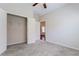 A large bedroom with a ceiling fan has doorways leading to a closet and another room at 2017 Grove Field Ln, Marietta, GA 30064